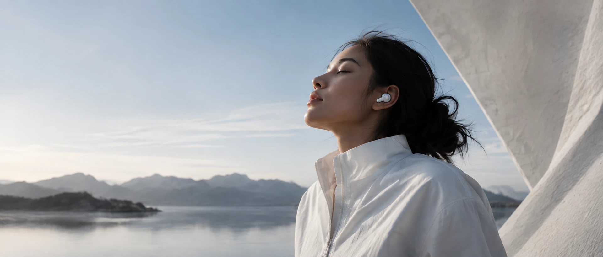 A quiet moment by the water, wearing wireless earbuds